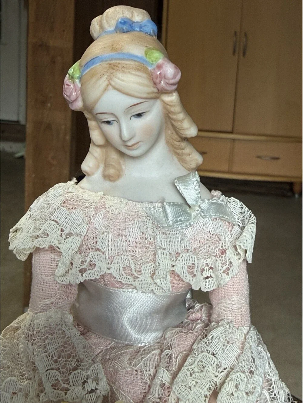 vtg porcelain doll Holding Flowers With Stand